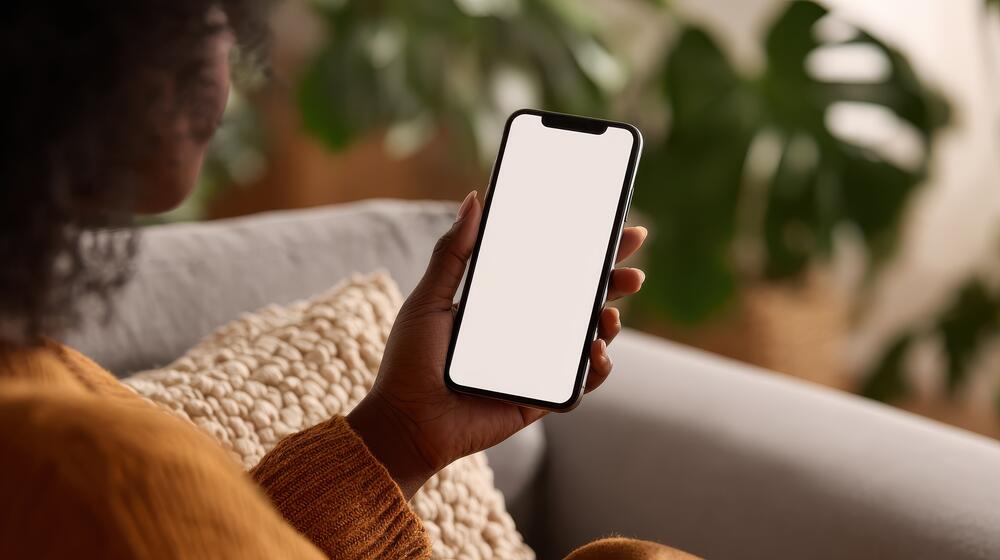 Photo of woman holding cell phone